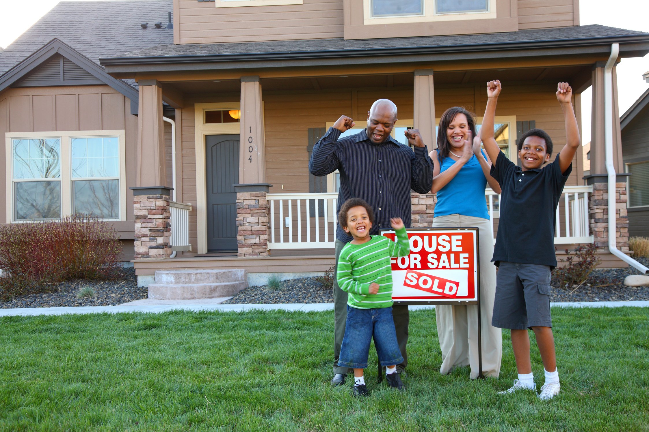 Family celebrates new home purchase